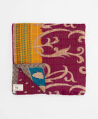 ethically made queen kantha quilt in magenta-purple with a bold cerulean blue flower design made by Anchal artisans