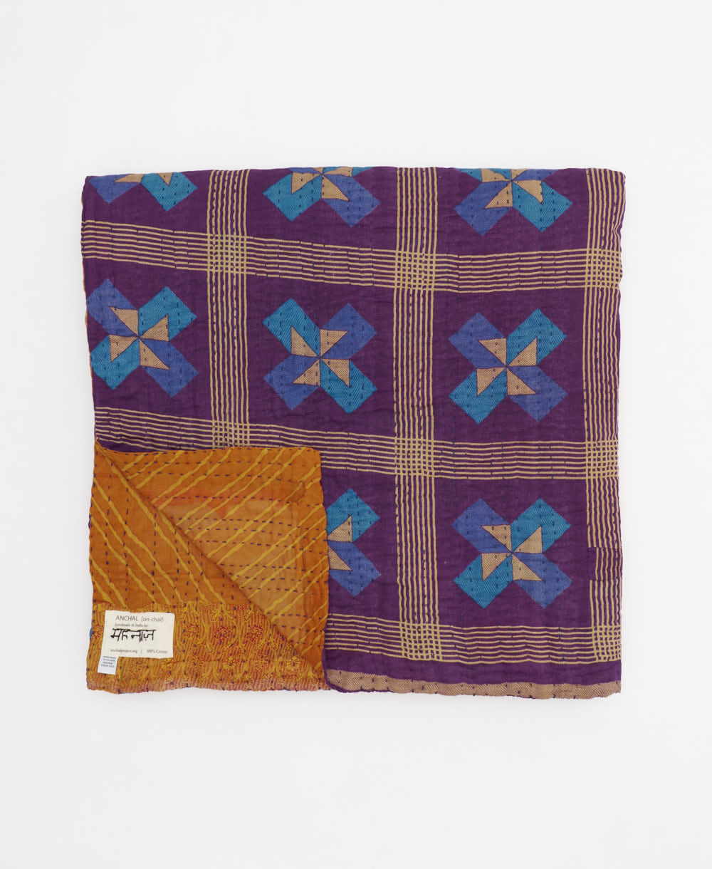 ethically made queen kantha quilt in pumpkin orange with a blue & purple triangle design made by Anchal artisans