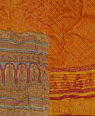 artisan-made kantha quilt in pumpkin orange geometric design made from upcycled vintage cotton saris