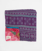 ethically made queen kantha quilt in bold hot pink with an oversized beige floral design made by Anchal artisans