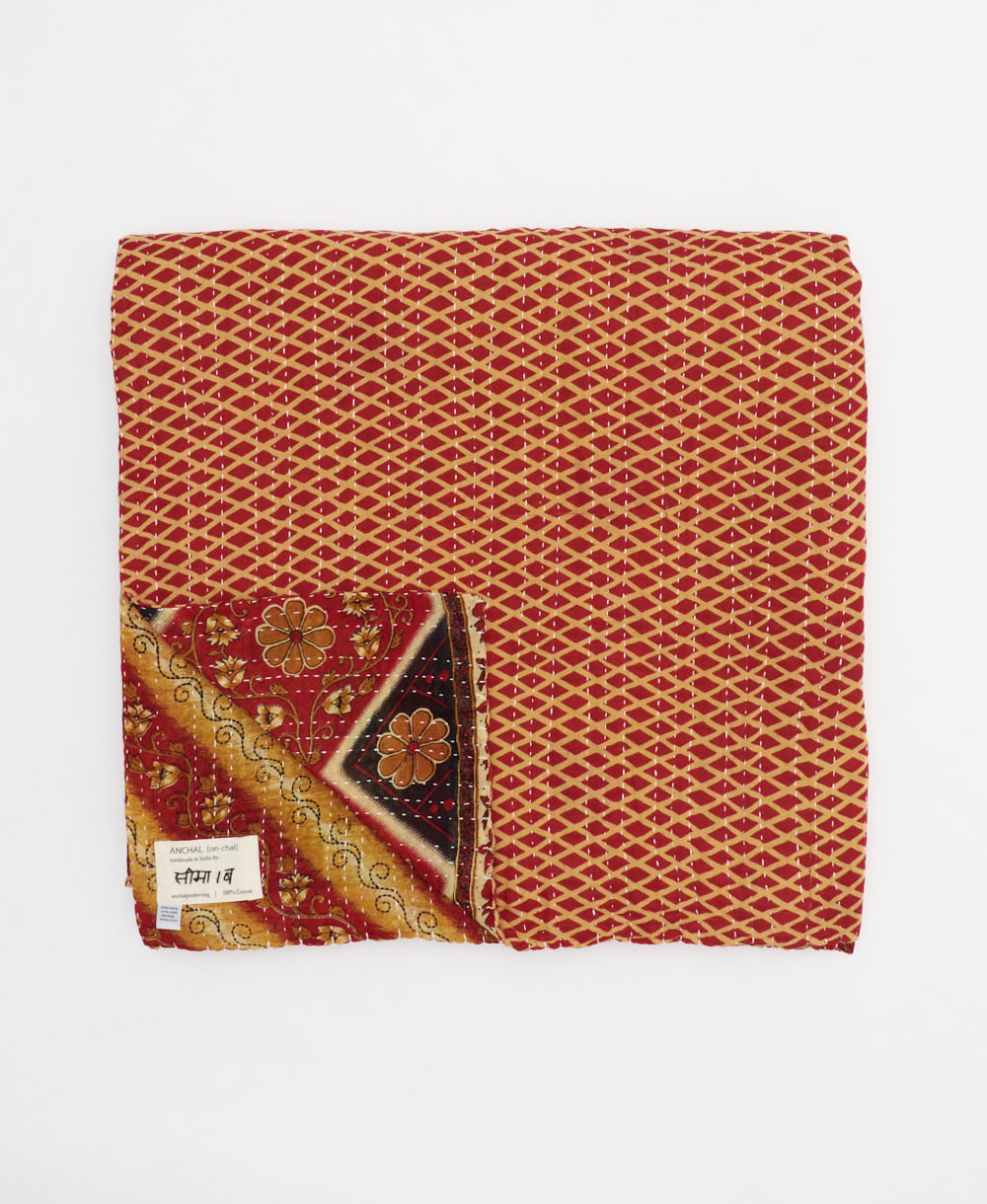 ethically made queen kantha quilt in orange and red with diagonal stripe design made by Anchal artisans