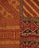 artisan-made kantha quilt in orange & red diagonal stripe design made from upcycled vintage cotton saris