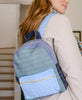 organic cotton patchwork colorblock backpack in cool tones on woman's shoulder