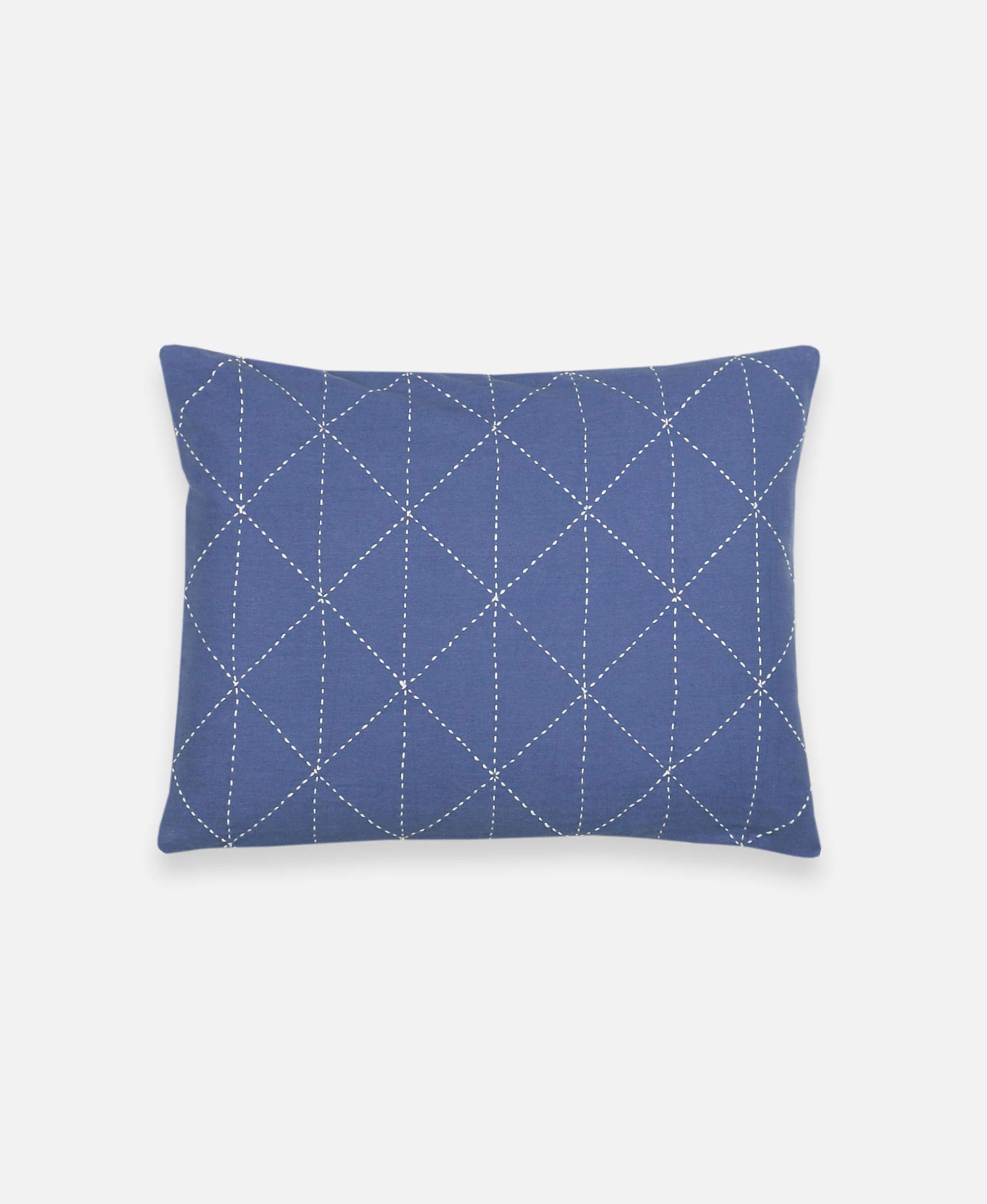 slate blue small pillow with white geometric embroidery forming a graph pattern