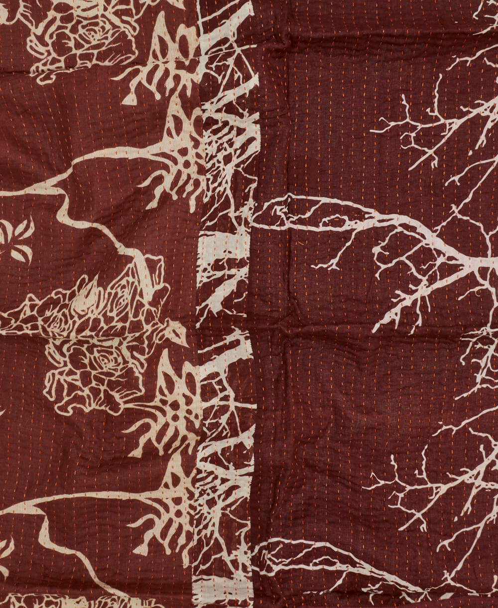 burgundy kantha blanket with white tree branch print with orange kantha stitching