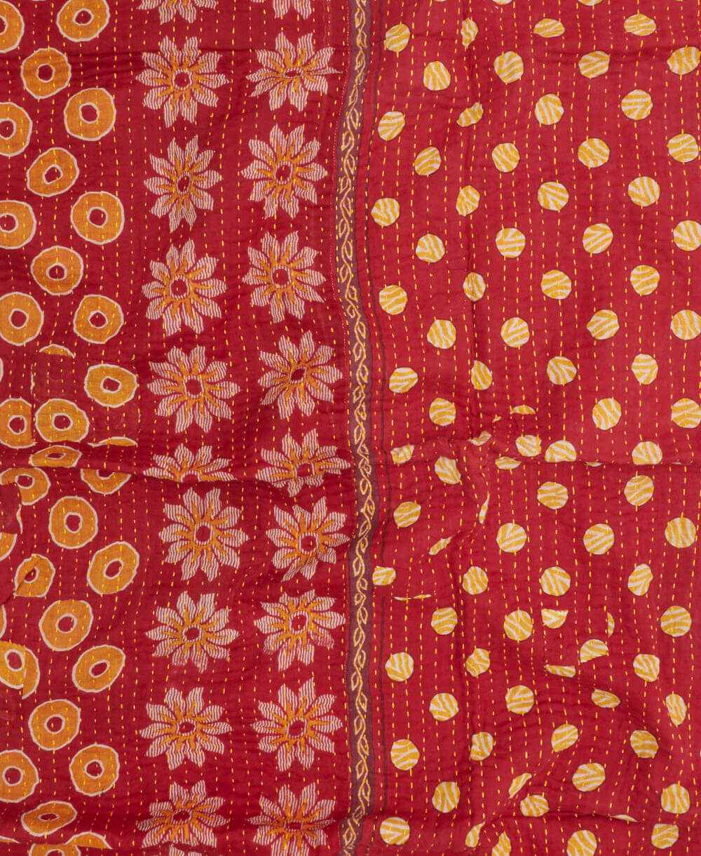 cherry red kantha blanket with white & yellow polka dot print with orange kantha stitching