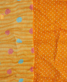 orange kantha blanket with pastel yellow polka dot print with blue kantha stitching