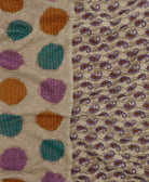 grey kantha blanket with polka dot print and purple paisley print with yellow kantha stitching