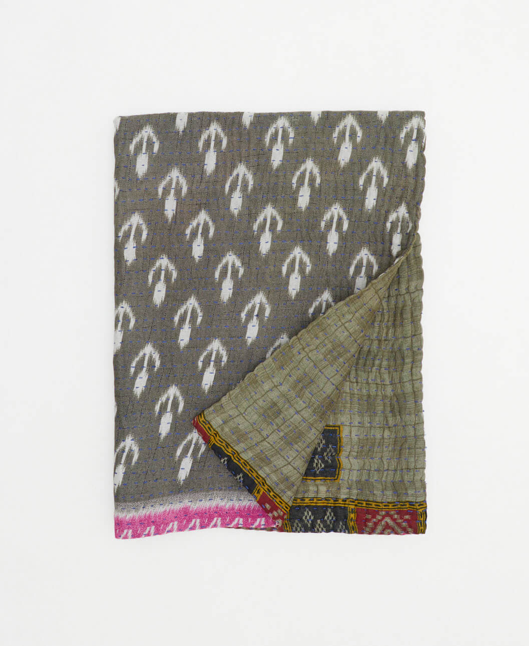 grey kantha blanket with white ikat print and blue kantha stitching