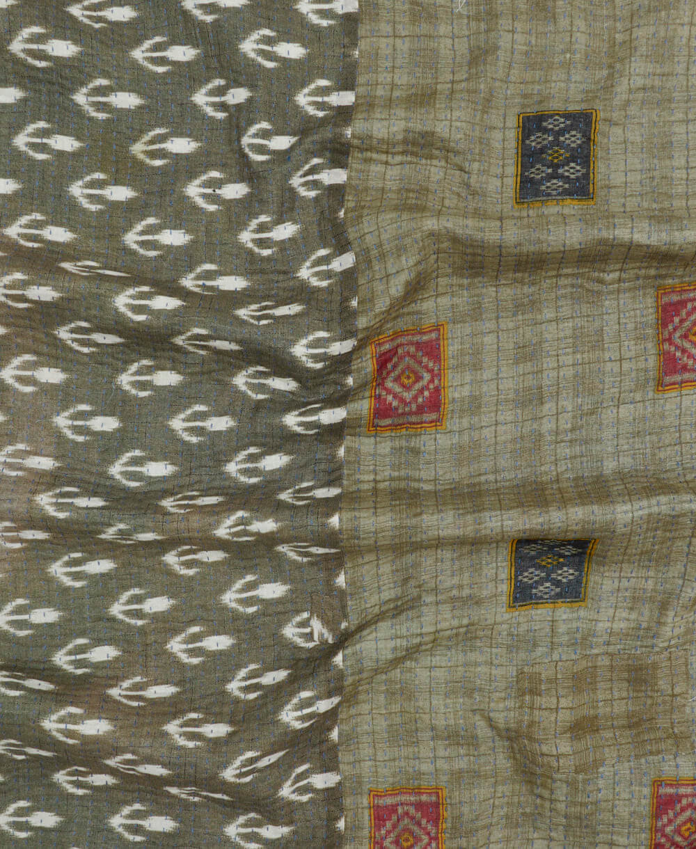 grey and tan kantha blanket with geometric square print and blue kantha stitching