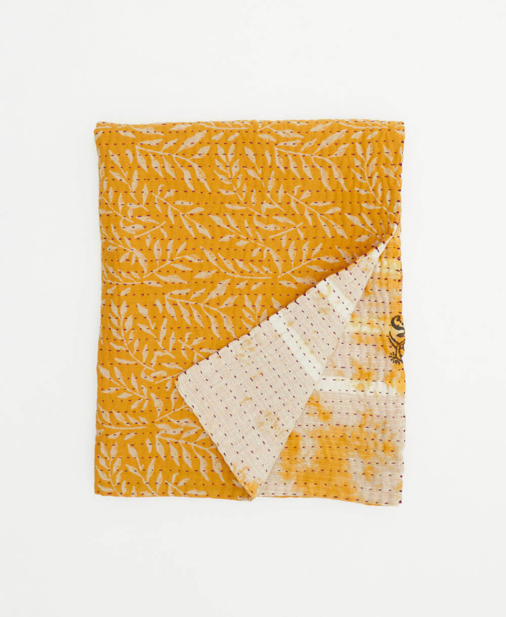 yellow-orange small kantha quilt handmade in India by women artisans from vintage cotton saris