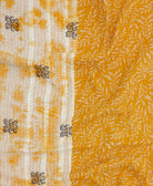 yellow-orange kantha blanket with ivory botanical print and maroon kantha stitching