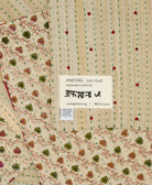 small kantha blanket in beige subtle stripe print with signature of the maker on the tag