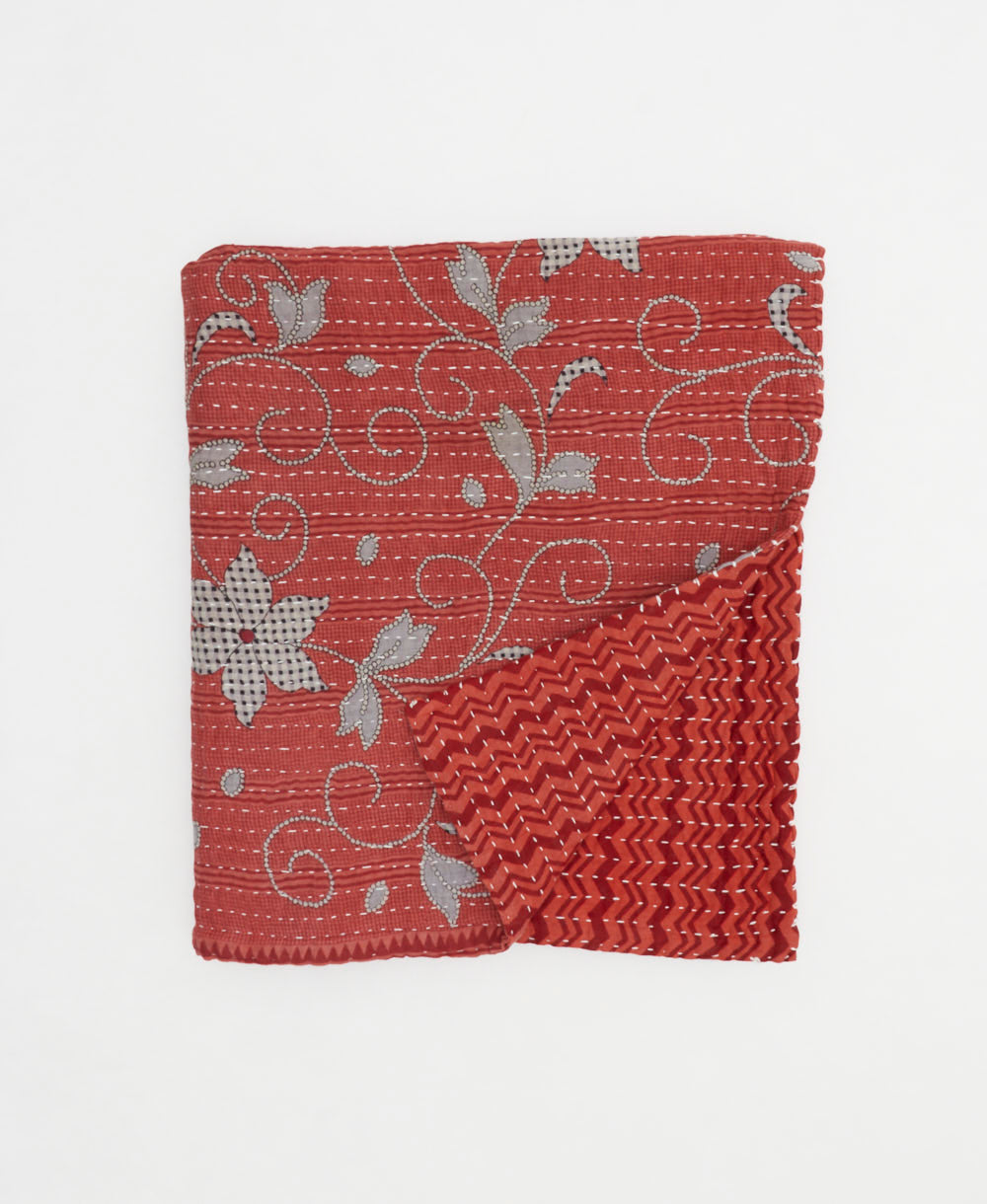 muted red small kantha quilt handmade in India by women artisans from vintage cotton saris