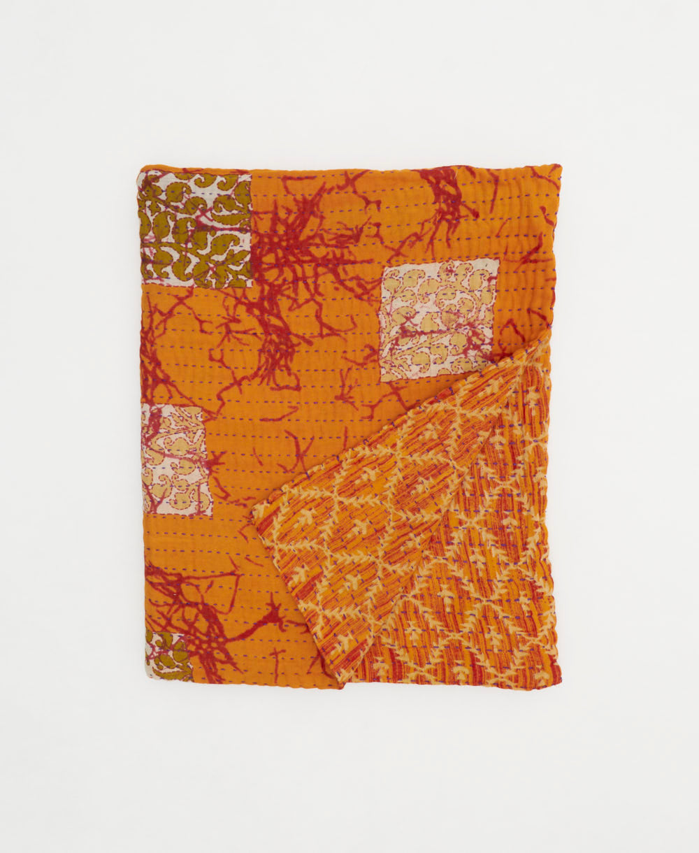 tangerine orange small kantha quilt handmade in India by women artisans from vintage cotton saris