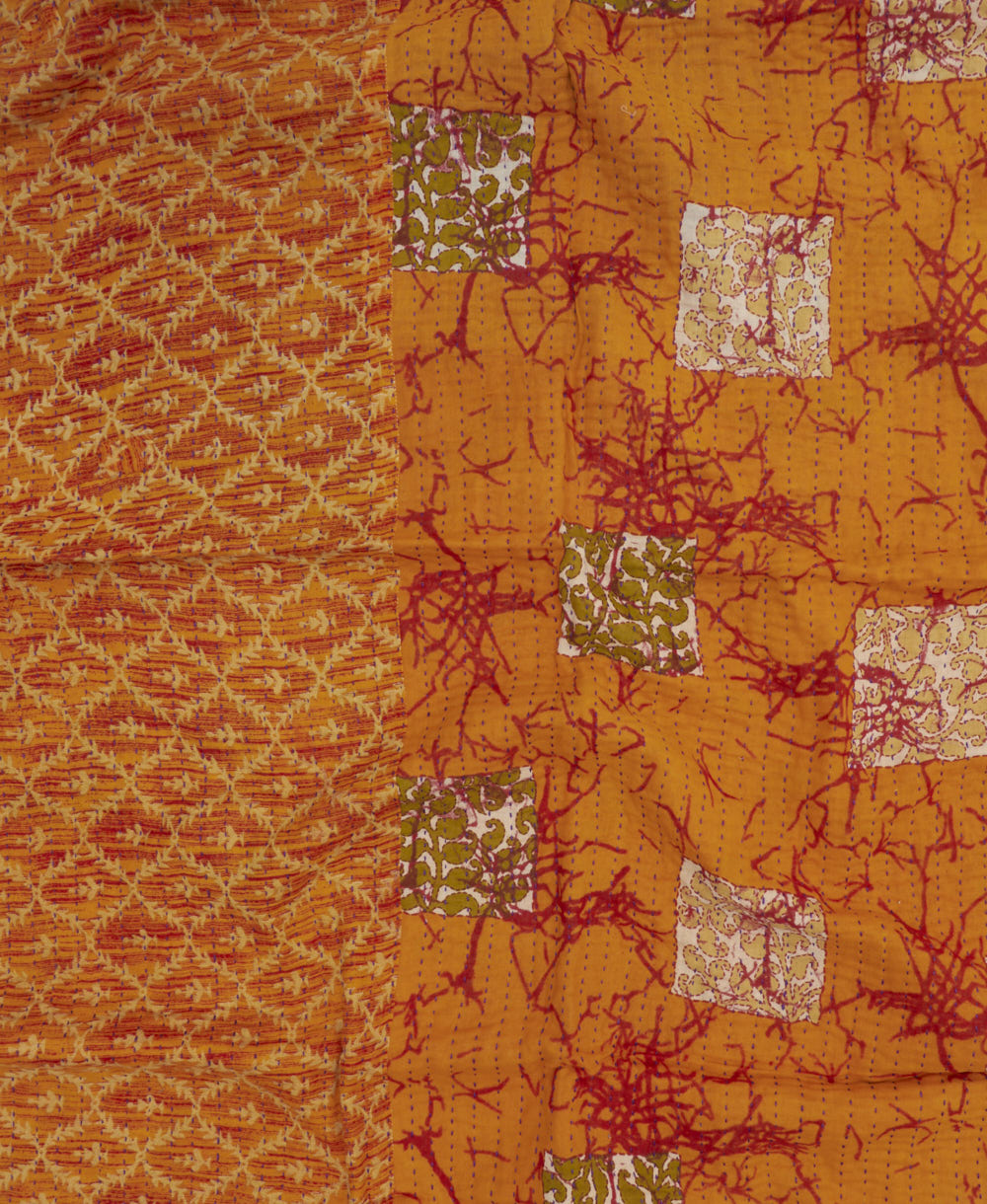 tangerine orange kantha blanket with red & tan diamond print and blue kantha stitching