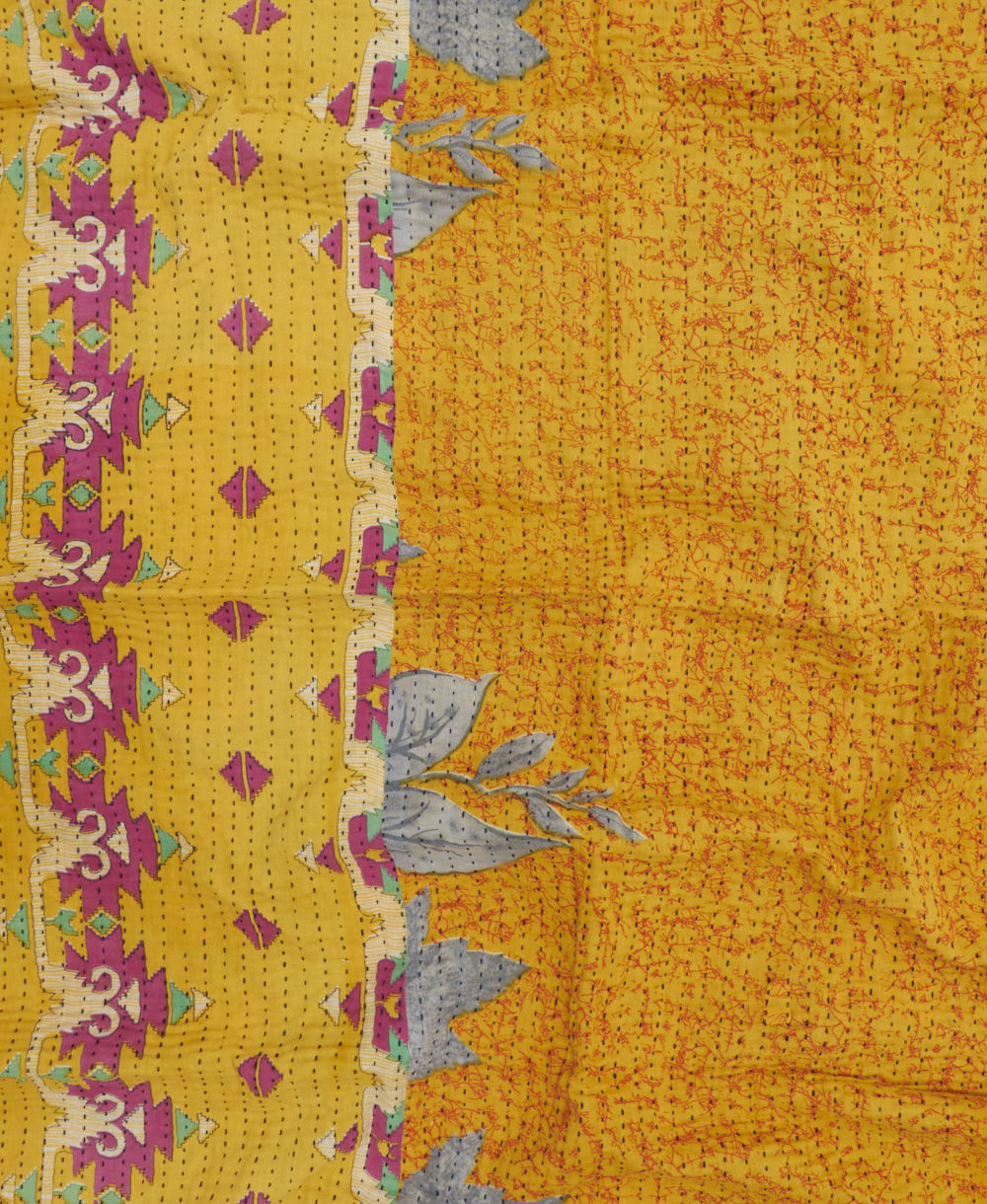 bright yellow kantha blanket with hot pink triangle print and black kantha stitching