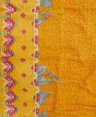 bright yellow kantha blanket with hot pink triangle print and black kantha stitching