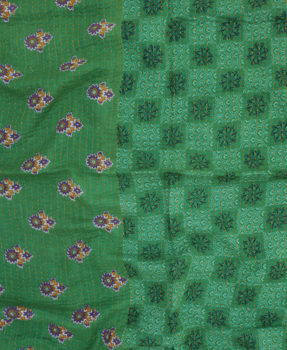 green kantha blanket with checkered floral print and yellow kantha stitching