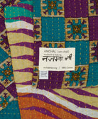 small kantha blanket with signature of the maker on the tag