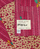 small kantha blanket with signature of the maker on the tag