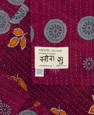 small kantha blanket with signature of the maker on the tag