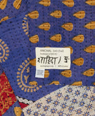 small kantha blanket with signature of the maker on the tag