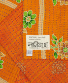 small kantha blanket with signature of the maker on the tag
