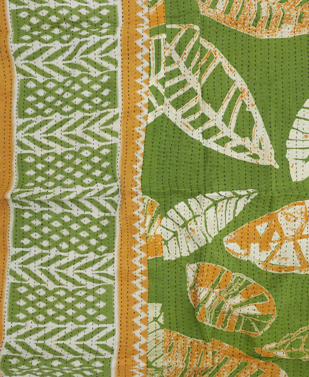 colorful kantha blanket made from upcycled vintage saris