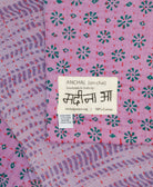 small kantha blanket with signature of the artisan maker on the tag