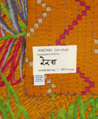 small kantha blanket with signature of the artisan maker on the tag