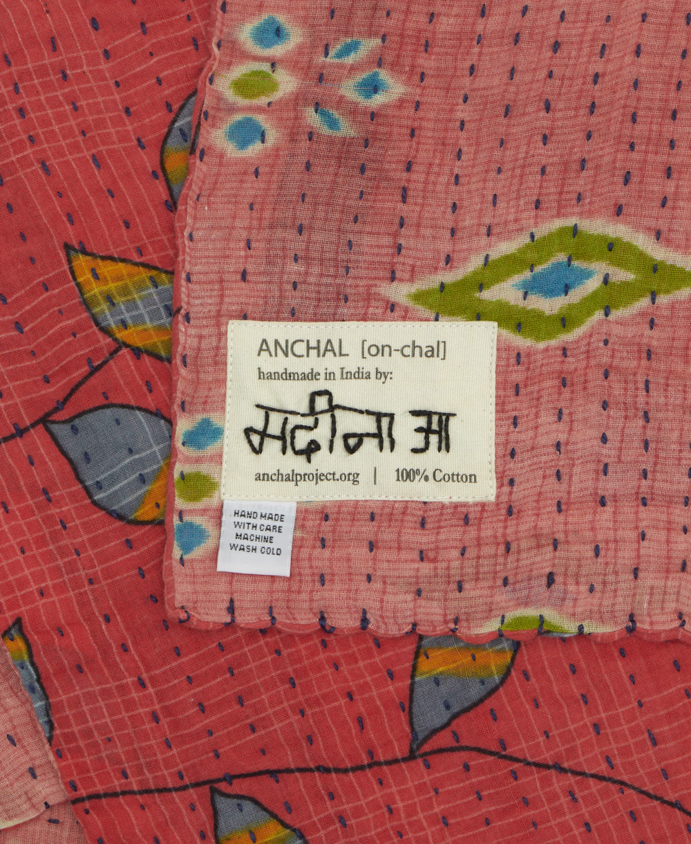 small kantha blanket with signature of the maker on the tag