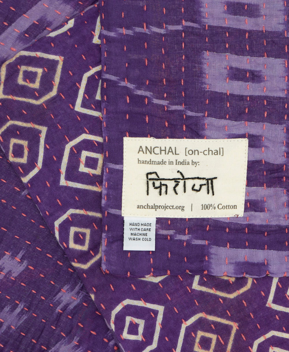 small kantha blanket with signature of the maker on the tag