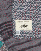 small kantha blanket with signature of the maker on the tag