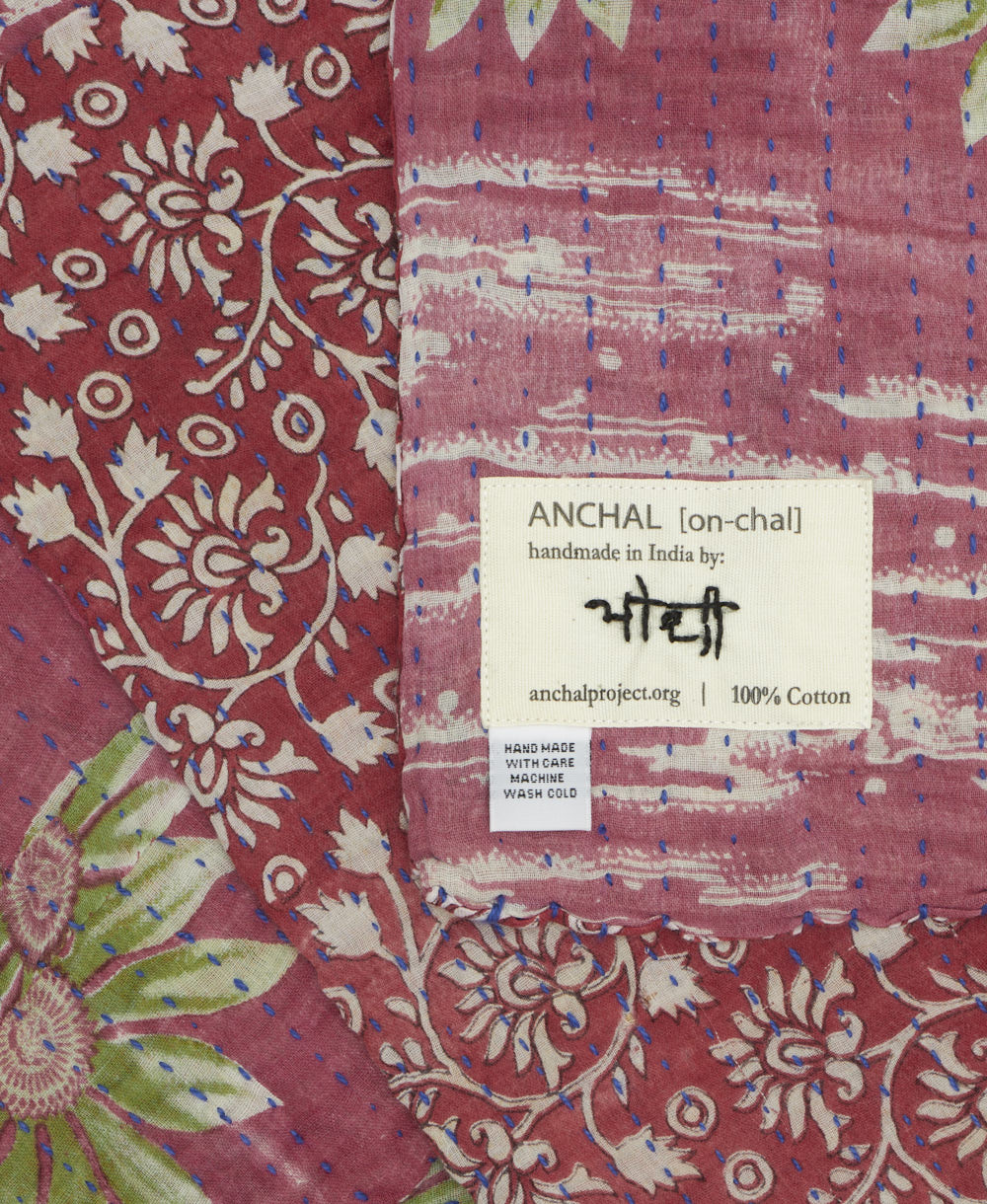 small kantha blanket with signature of the maker on the tag
