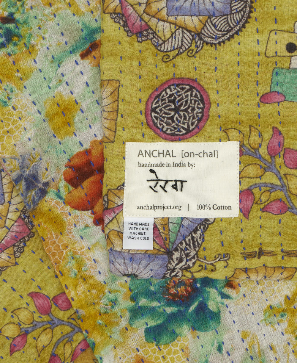 small kantha blanket with signature of the maker on the tag