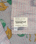 small kantha blanket with signature of the maker on the tag