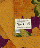 small kantha blanket with signature of the maker on the tag
