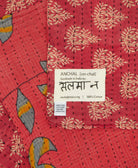 small kantha blanket with signature of the maker on the tag