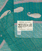small kantha blanket with signature of the maker on the tag