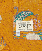 small kantha blanket with signature of the maker on the tag