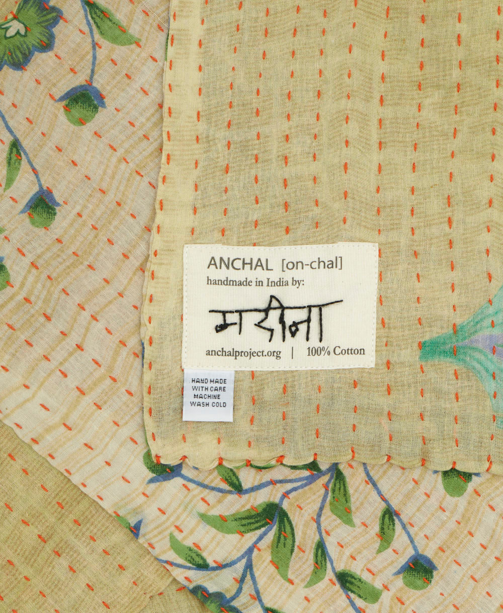 small kantha blanket with signature of the maker on the tag