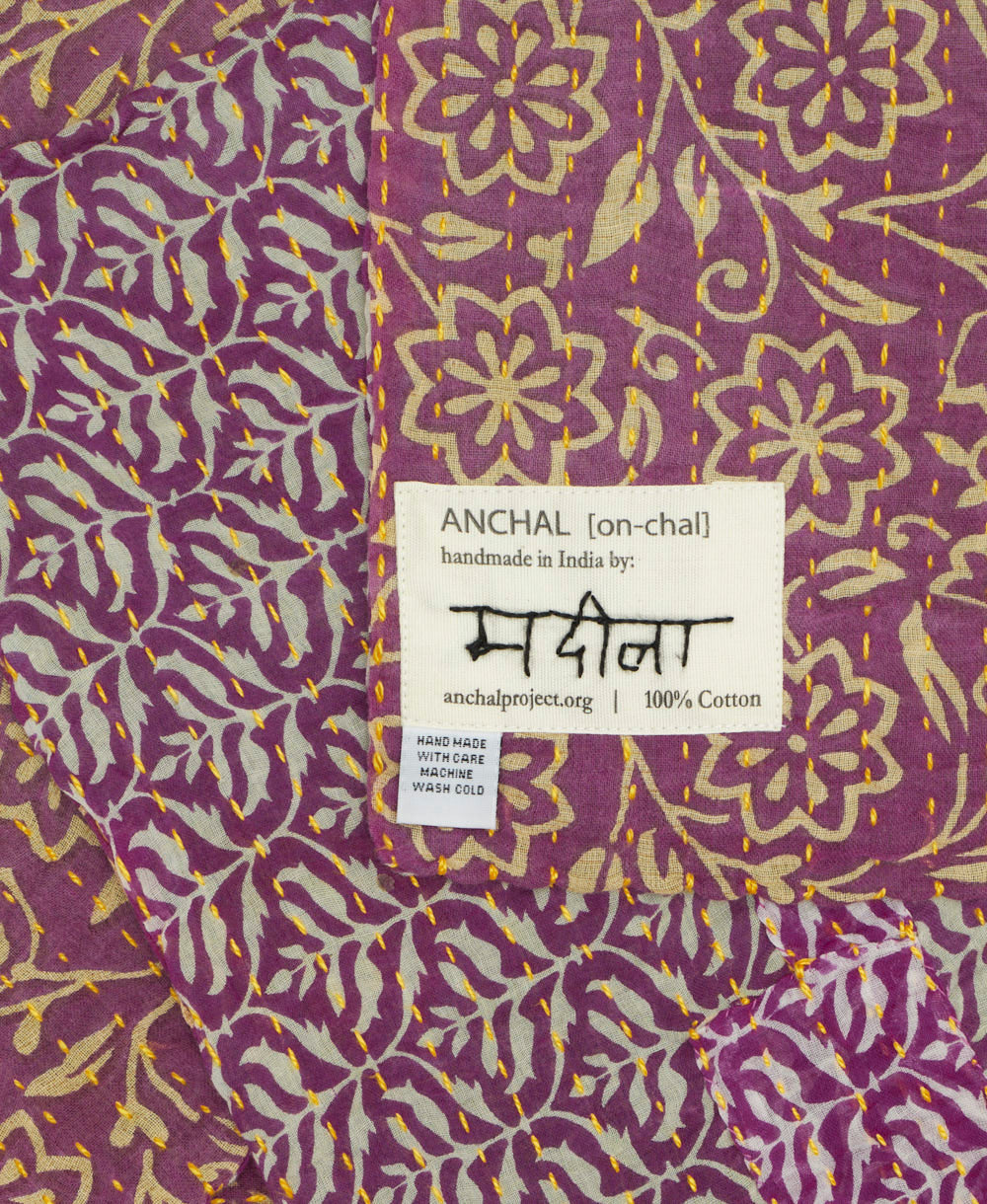 small kantha blanket with signature of the maker on the tag