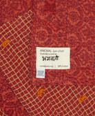 small kantha blanket with signature of the maker on the tag