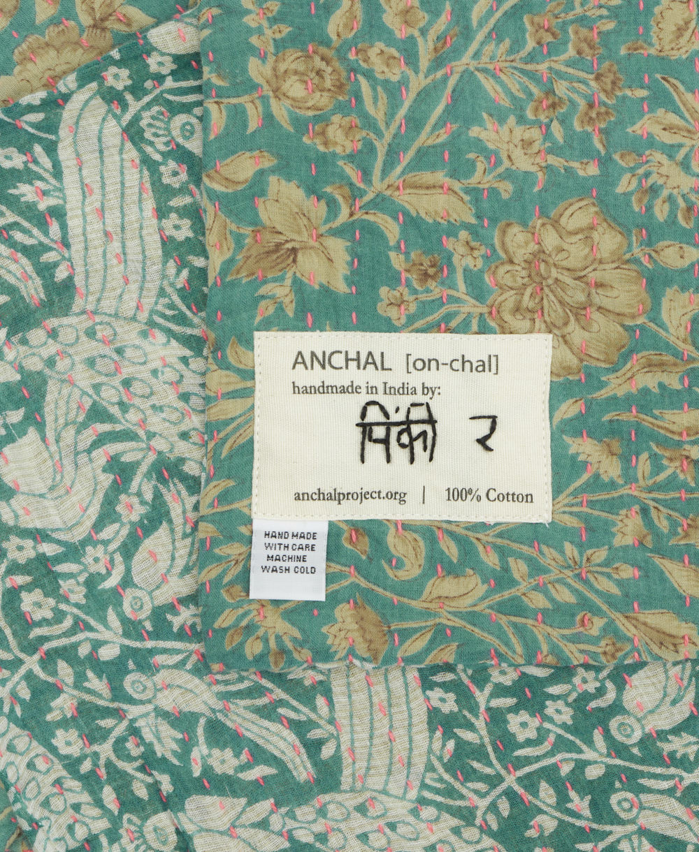 small kantha blanket with signature of the maker on the tag
