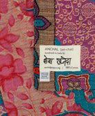 small kantha blanket with signature of the maker on the tag