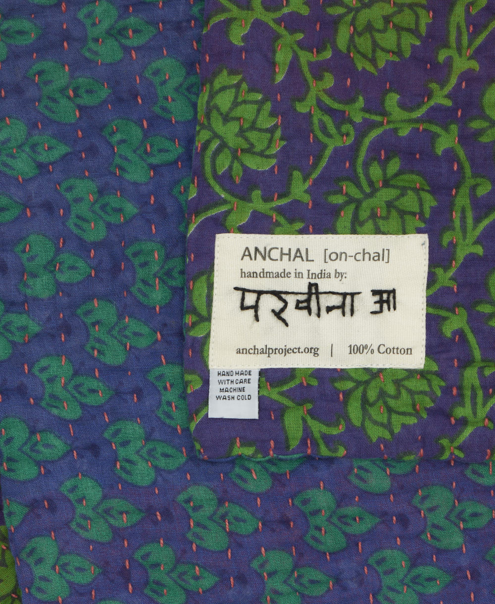 small kantha blanket with signature of the maker on the tag
