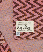 small kantha blanket with signature of the maker on the tag