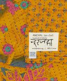 small kantha blanket with signature of the maker on the tag