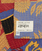 small kantha blanket with signature of the maker on the tag